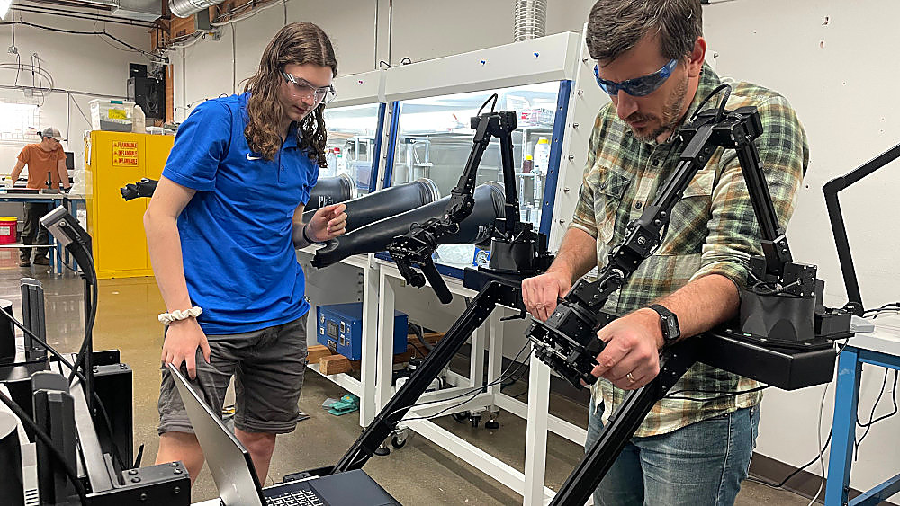 Operators working together at the Rose City Robotics dual-rig setup