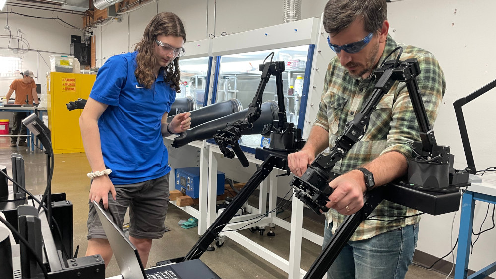Operators working together at the Rose City Robotics dual-rig setup